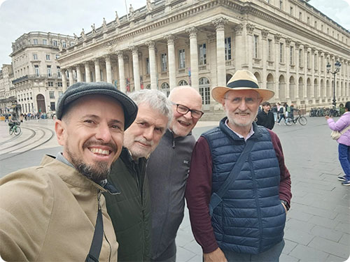 Happy group in front of the Grand Théâtre in Bordeaux